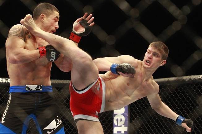 Stephen Thompson lands a kick to Robert Whittaker during their fight at UFC 170 Saturday, Feb. 22, 2014 at the Mandalay Bay Events Center.
