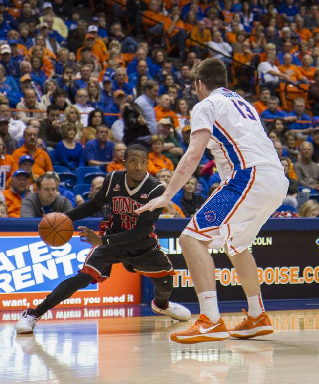 UNLV guard Deville Smith works on Boise State forward Nick Duncan in UNLV's 91-90 overtime loss to Boise State at Taco Bell Arena in Boise on Saturday, Feb. 22, 2014.