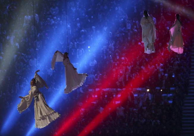 Performers hang from wires at the start of the closing ceremony for the 2014 Winter Olympics at Fisht Olympic Stadium in Sochi, Russia, Feb. 23, 2014. (Josh Haner/The New York Times).