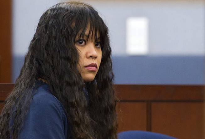 Elinor Indico, accused of stabbing her pregnant sister-in-law to death, appears in court at the Regional Justice Center Monday, Feb. 24, 2014.