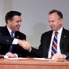 Nevada Gov. Brian Sandoval, left, and Delaware Gov. Jack Markell shake hands after signing the Multi-State Internet Gambling Agreement in the Delaware State Office Building in Wilmington Tuesday morning, Feb. 26, 2014.