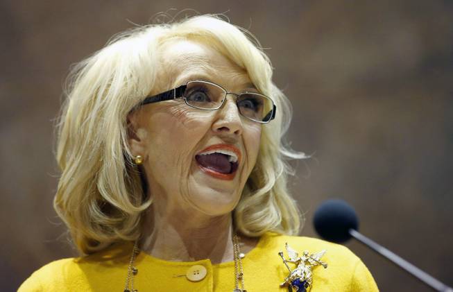 In this Jan. 13, 2014, photo, Arizona Gov. Jan Brewer speaks during her State of the State address at the Arizona Capitol in Phoenix.