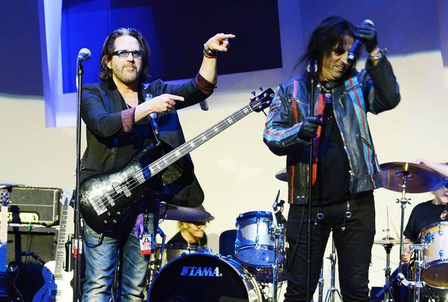 Kip Winger and Alice Cooper perform during the Kerry Simon "Simon Says Fight MSA" benefit concert at the Keep Memory Alive Center in Las Vegas on Feb. 27, 2014.