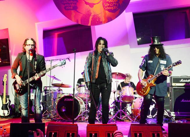 Kip Winger, Alice Cooper and Slash during the Kerry Simon "Simon Says Fight MSA" benefit concert at The Keep Memory Alive Center in Las Vegas on Feb. 27, 2014.
