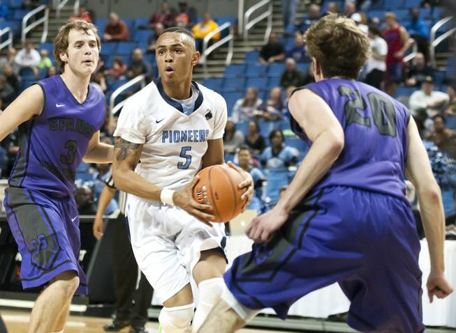 Gerad Davis knifes through the lane on his way to the hoop Thursday, Feb. 27, 2014 as Canyon Springs defeats Spanish Springs 66-51 in the semifinals of the Nevada State Championships at Lawlor Events Center in Reno.
