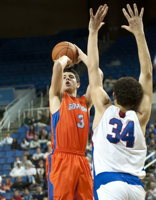 Tanner Leishman pulls up for a jumper just in front of the three point line Thursday, Feb. 27, 2014 as Bishop Gorman defeats Reno 68-27 in the semifinals of the Nevada State Championships at Lawlor Events Center in Reno.