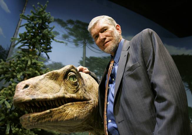 Ken Ham, founder of the nonprofit ministry Answers in Genesis, stands with one of his favorite animatronic dinosaurs during a tour of Creation Museum on Thursday, May 24, 2007, in Petersburg, Ky.


