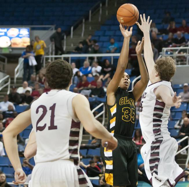 Sherron Wilson pulls up in the lane for a jumper in the face of a defender Saturday, March 1, 2014 as Clark High School defeated Elko High School 43-25 winning the Division I-A state championship at Lawlor Event Center in Reno.
