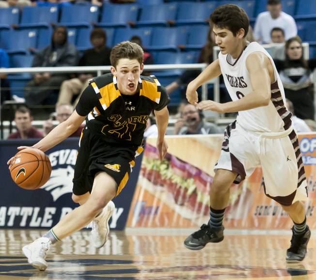 Carter Olsen, left, works into the lane with a defender on his hip Saturday, March 1, 2014 as Clark High School defeated Elko High School 43-25 winning the Division I-A state championship at Lawlor Event Center in Reno.