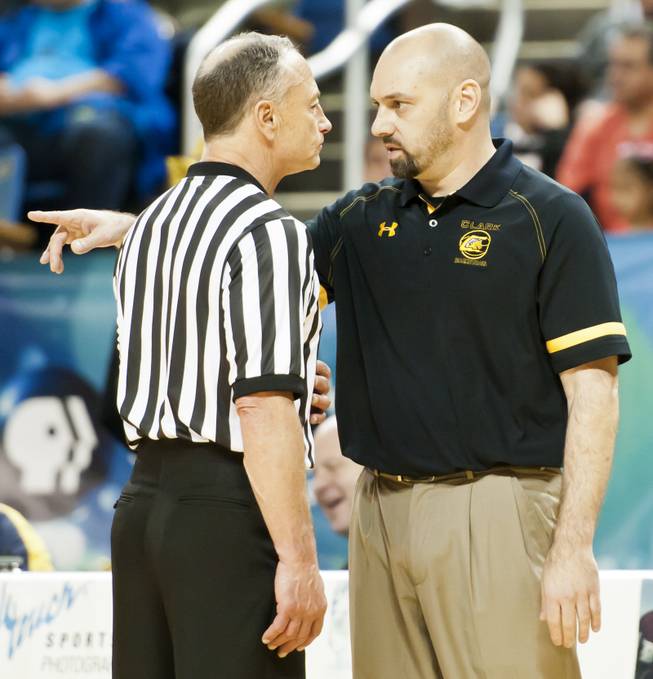 Head coach Chad Beeten speaks with a referee during a timeout in the second half Saturday, March 1, 2014 as Clark High School defeated Elko High School 43-25 winning the Division I-A state championship at Lawlor Event Center in Reno.