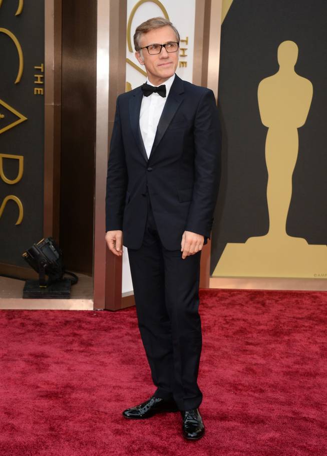 Christoph Waltz arrives at the Oscars on Sunday, March 2, 2014, at the Dolby Theatre in Los Angeles.  (Photo by Jordan Strauss/Invision/AP)
