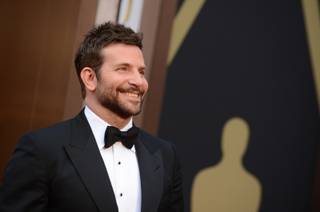Bradley Cooper arrives at the Oscars on Sunday, March 2, 2014, at the Dolby Theatre in Los Angeles.  (Photo by Jordan Strauss/Invision/AP)