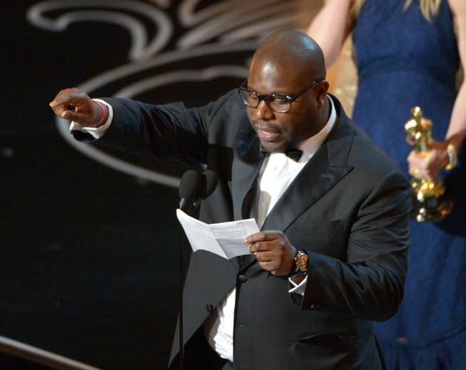 Steve McQueen accepts the award for the best picture of the year for "12 Years a Slave" during the Oscars at the Dolby Theatre on Sunday, March 2, 2014, in Los Angeles.  (Photo by John Shearer/Invision/AP)