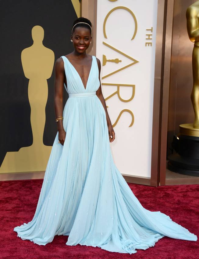 Lupita Nyong'o arrives at the Oscars on Sunday, March 2, 2014, at the Dolby Theatre in Los Angeles.  (Photo by Jordan Strauss/Invision/AP)