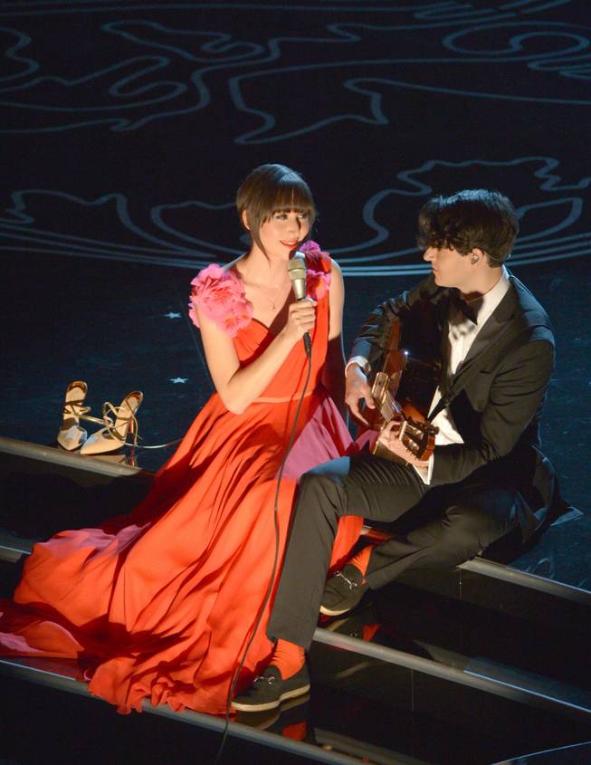 Karen O, left, and Ezra Koenig perform during the Oscars at the Dolby Theatre on Sunday, March 2, 2014, in Los Angeles.  (Photo by John Shearer/Invision/AP)