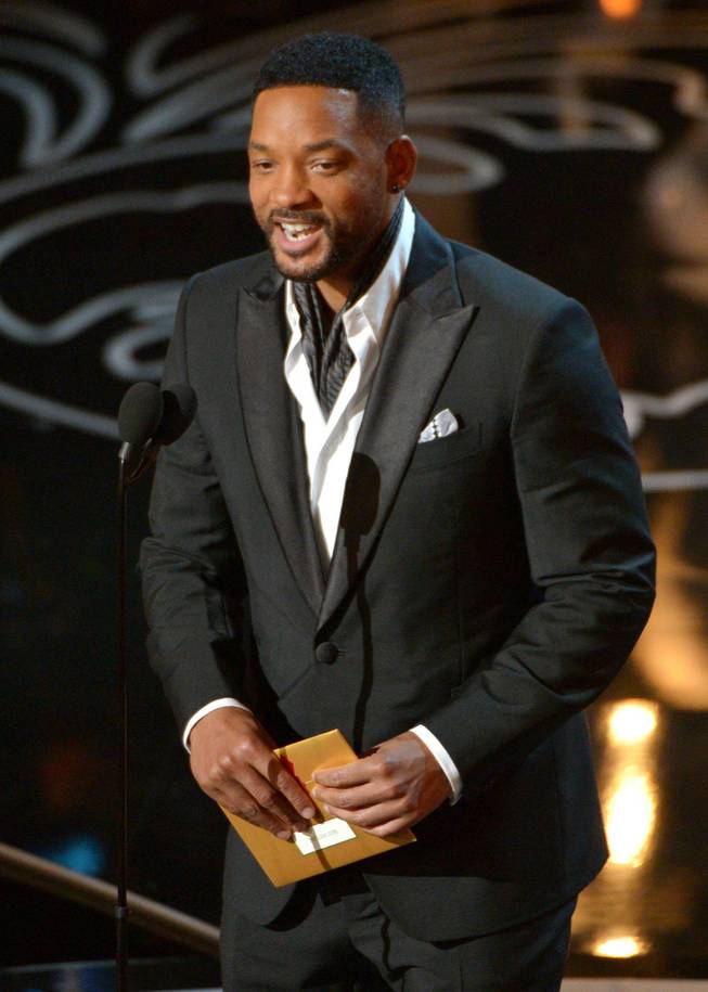 Will Smith speaks on stage during the Oscars at the Dolby Theatre on Sunday, March 2, 2014, in Los Angeles.  (Photo by John Shearer/Invision/AP)