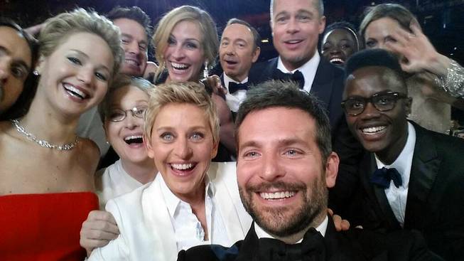 This image released by Ellen DeGeneres shows actors front row from left, Jared Leto, Jennifer Lawrence, Meryl Streep, Ellen DeGeneres, Bradley Cooper, Peter Nyong’o Jr., and, second row, from left, Channing Tatum, Julia Roberts, Kevin Spacey, Brad Pitt, Lupita Nyong’o and Angelina Jolie as they pose for a selfie on a cell phone during the Oscars at the Dolby Theater on Sunday, March 2, 2014, in Los Angeles.