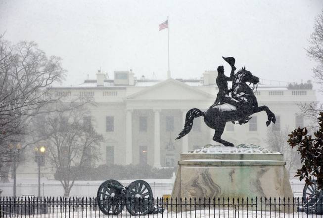 The statue of President Andrew Jackson at the Battle of New Orleans, sculpted in 1853 by Clark Mill sits in the falling snow in Lafayette Park across the street from the White House in Washington, Monday, March 3, 2014. The winter weather prompted area schools and the federal government to close and the National Weather Service has issued a Winter Storm Warning for the greater Washington Metropolitan region.