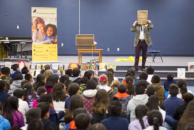 Comedy-magician Mac King performs a trick as he kicks off his Magical Literacy Tour: Nevada Reading Week 2014 with students at Vegas Verdes Elementary School Tuesday, March 4, 2014. For the fourth year, the Harrahs headliner will visit schools to perform magic tricks, talk about the importance of reading and distribute books collected during book drives.