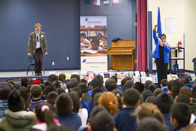Beverly Mathis, right, director of early learning for the Public Education Foundation, and Comedy-magician Mac King kick off King's Magical Literacy Tour: Nevada Reading Week 2014 with students at Vegas Verdes Elementary School Tuesday, March 4, 2014. For the fourth year, the Harrahs headliner will visit schools to perform magic tricks, talk about the importance of reading and distribute books collected during book drives.