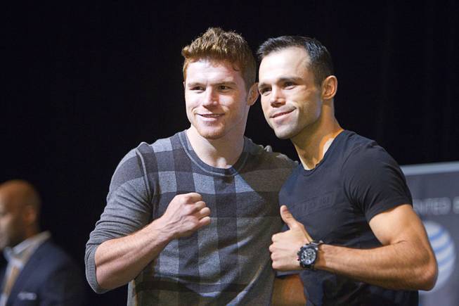 Super welterweight boxer Canelo Alvarez, left, poses with his brother Ricardo Alvarez during a news conference at the MGM Grand Thursday, March 6, 2014. Alvarez and Alfredo Angulo, both of Mexico, will fight at the MGM Grand Garden Arena on Saturday. Ricardo Alvarez will fight Sergio Thompson in a 10-round, lightweight bout.