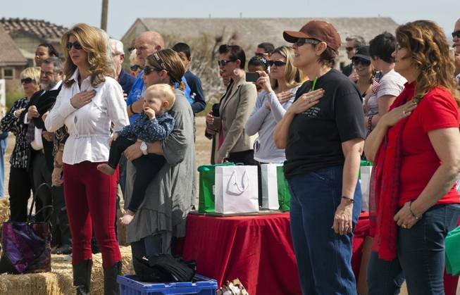 The Pledge of Allegiance begins during the Horses4Heroes ribbon-cutting ceremony and grand-opening at Tule Springs on Thursday, March 06, 2014.