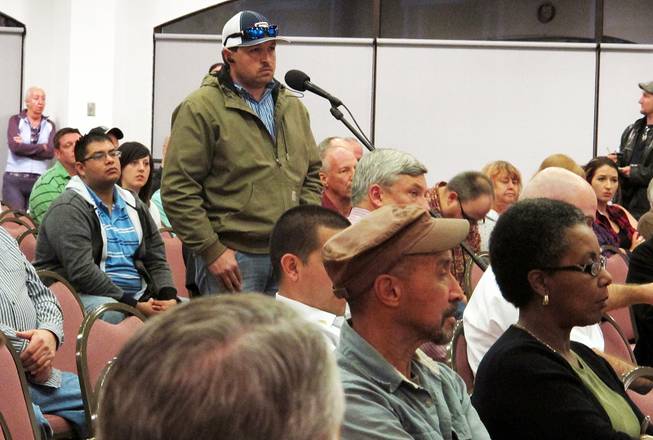 A member of the community speaks of the Feb. 14, 2014 radiation leak during a community meeting in Carlsbad, N.M., Feb. 24, 2014. 