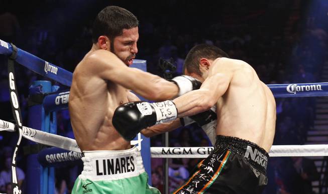 Jorge Linares, left, of Venezuela punches Nihito Arakawa of Japan during their lightweight fight at the MGM Grand Garden Arena on Saturday, March 8, 2014.