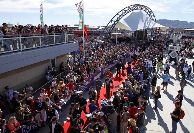 Fans wait for drivers and celebrities before the Kobalt 400 NASCAR Sprint Cup Series race at the Las Vegas Motor Speedway Sunday, March 9, 2014.