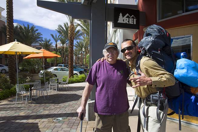 Robert Sorensen, 27, poses with his father Rick Sorensen before heading out on a walk from Henderson to Israel Monday, March 10, 2014. Sorensen said he is not a religious man but that it was a "spiritual" journey. Sorensen estimated the trip to be 16,500 miles.