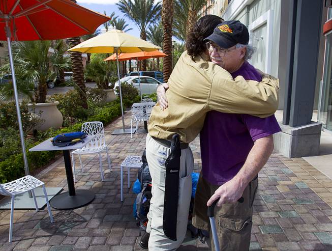 Robert Sorensen, 27, hugs his father Rick Sorensen before leaving on a walk from Henderson to Israel Monday, March 10, 2014. Sorensen said he is not a religious man but that it was a "spiritual" journey. Sorensen estimated the trip to be 16,500 miles.