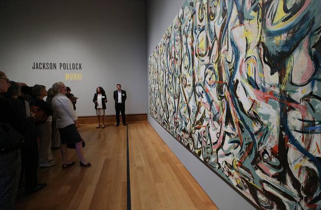 Members of the media preview Jackson Pollock's “Mural,” 1943, at the J. Paul Getty Museum in Los Angeles on Monday, March 10, 2014. 