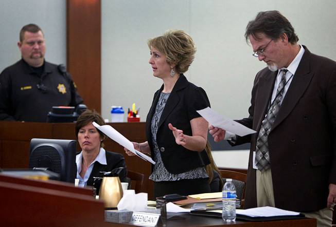 Attorney Lisa Zastrow, center, representing the Animal Foundation, speaks during a hearing at the Regional Justice Center Tuesday, March 11, 2014. Steven Sweiker, center, Clark County Deputy District Attorney, listens at right. Judge Kenneth Cory kept a temporary restraining order in place preventing an Animal Foundation raffle of puppies rescued in a  Jan. 27 fire at the Prince and Princess Pet Shop. An evidentiary hearing is scheduled for March 19.