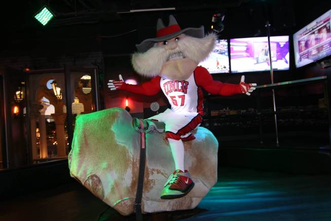 Hey Reb rides the bull at the first-anniversary celebration of ...