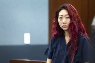 Pet shop owner Gloria Lee appears in court at the Regional Justice Center Wednesday, March 12, 2014. Lee and co-defendant Kirk Bills pleaded not guilty to charges of torching the pet shop where 27 puppies were rescued, and a judge rejected a bid for lower bail.