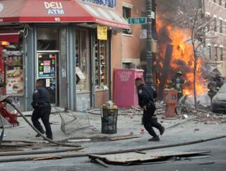 Emergency crews respond to an explosion that leveled two apartment buildings in the East Harlem neighborhood of New York, Wednesday, March 12, 2014. The blast happened after a neighbor reported smelling natural gas.