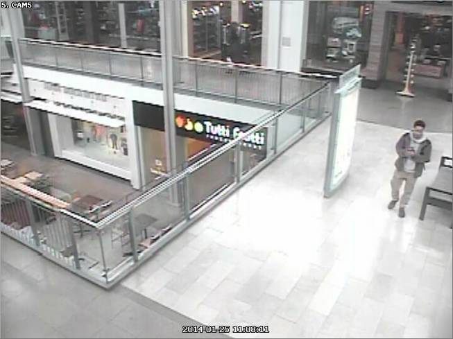 In this Jan. 25, 2014, video surveillance photo provided by the Howard County Police Department, Darion Marcus Aguilar approaches a Zumiez skateboarding and snowboarding store in Columbia Mall in Columbia, Md. Aguilar killed two employees store before turning his gun on himself.