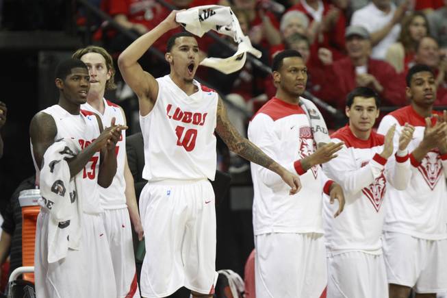 New Mexico guard Kendall Williams (10) and the rest of the Lobos bench celebrate a play against  Fresno State during their Mountain West Conference tournament game Thursday, March 13, 2014 at the Thomas & Mack Center. New Mexico won 93-77.