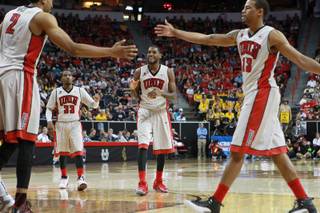 UNLV's Khem Birch, Deville Smith, Roscoe Smith and Bryce Dejean-Jones celebrate an and-one against Wyoming during their Mountain West Conference tournament game Thursday, March 13, 2014, at the Thomas & Mack Center. UNLV won the game 71-67.