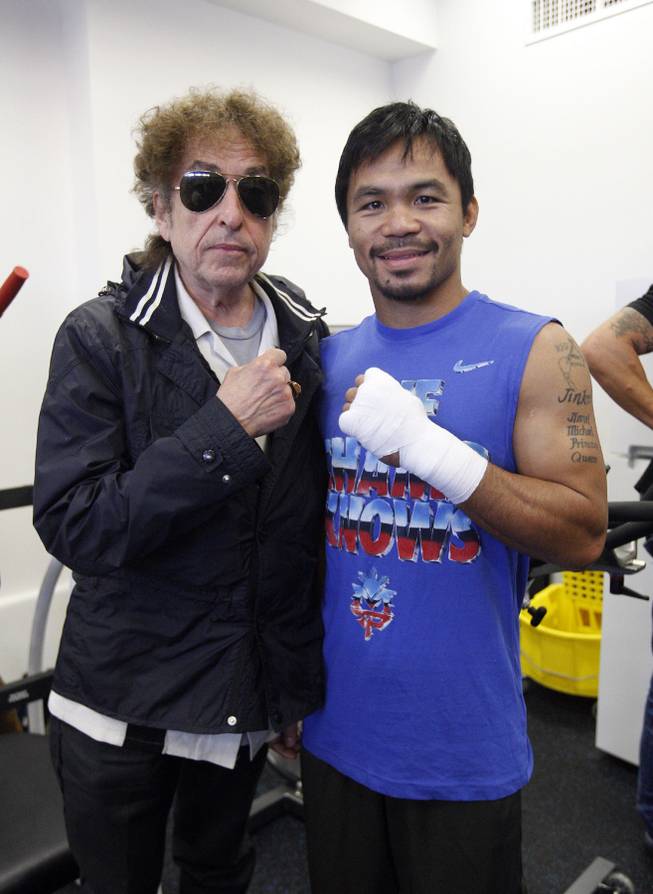 Unlikely sparring partners Bob Dylan (left) and Manny Pacquaio.