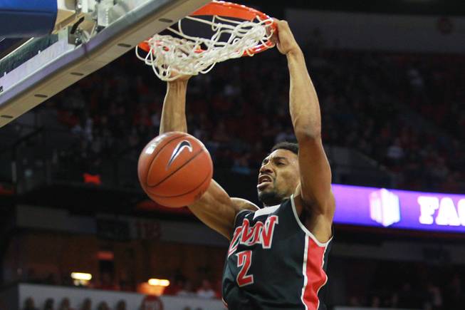 UNLV forward Khem Birch dunks on San Diego State during the first half of their Mountain West Conference semifinal game Friday, March 14, 2014 at the Thomas & Mack Center.