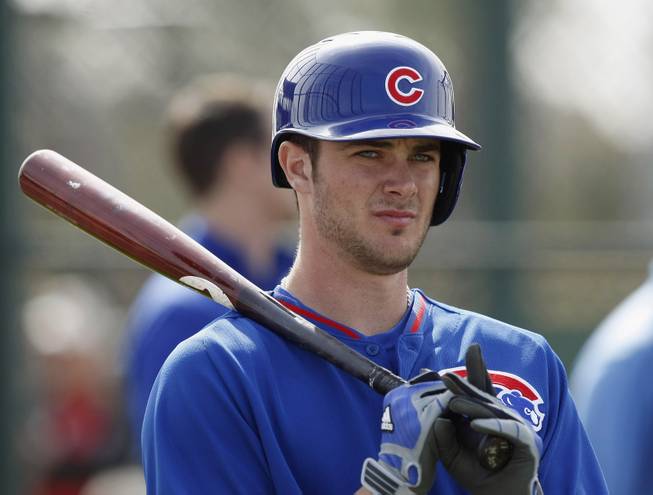 In this Feb. 21, 2014 file photo, Chicago Cubs third baseman Kris Bryant prepares to take batting practice during spring training baseball practice in Mesa, Ariz. Bryant, 22, is a big-time prospect.  