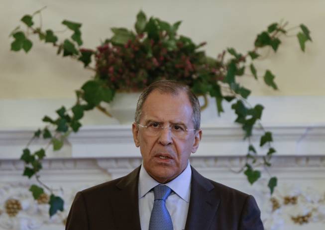 Russian Foreign Minister Sergey Lavrov speaks at a press conference at the Russian Ambassador's residence in London, Friday, March 14, 2014. Russian Foreign Minister Sergey Lavrov spoke following a meeting with US Secretary of State John Kerry.