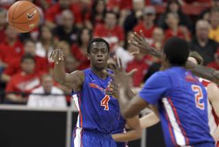 Boise State's Thomas Broplehpasses to his teammate Derrick Marks during the first half of an NCAA college basketball game against New Mexico in the semifinals of the Mountain West Conference men's tournament Friday, March 14, 2014, in Las Vegas. (AP Photo/Isaac Brekken)