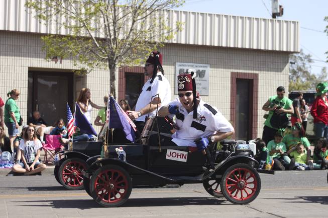A member of the Zelzah Shriners greets the crowd during the annual St. Patrick's Day parade in Henderson Saturday, March 15, 2014.