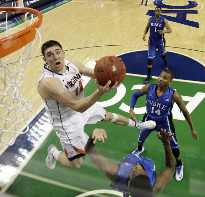 Virginia's Joe Harris goes to the basket against Duke in the second half of an NCAA college basketball game in the championship of the Atlantic Coast Conference tournament in Greensboro, N.C., Sunday, March 16, 2014. Virginia won 72-63. Harris was the tournament MVP.