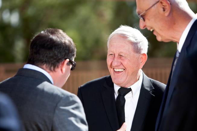 Grandson Brendan Gaughan, from left, Bill Perrin and Tony Hegler laugh with each other while sharing stories about John Davis "Jackie" Gaughan during his memorial mass at St. Viator Catholic Church in Las Vegas on St. Patrick's Day, March 17, 2014.