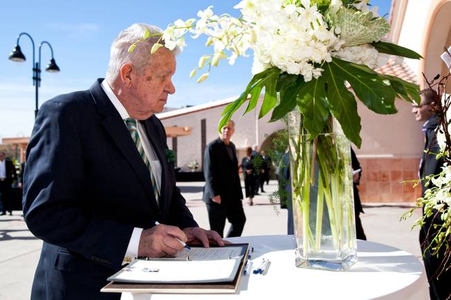 Gene Kilroy signs the guestbook while attending the memorial mass for John Davis "Jackie" Gaughan held at St. Viator Catholic Church in Las Vegas on St. Patrick's Day, March 17, 2014.