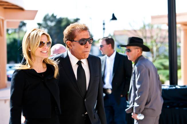 Steve Wynn with his wife Andrea Hissom arrives for the memorial mass for John Davis "Jackie" Gaughan held at St. Viator Catholic Church in Las Vegas on St. Patrick's Day, March 17, 2014.