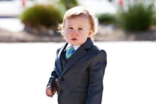 John Davis "Jackie" Gaughan's youngest great grandson, 17-month-old Ryland Gaughan, looks for his mom while attending the memorial mass for his grandfather at St. Viator Catholic Church in Las Vegas on St. Patrick's Day, March 17, 2014.